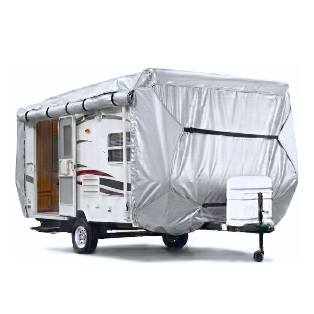 Silver RV cover on a small travel trailer with a white background and the entry door is towards the rear where the two side panels are rolled up to expose the side